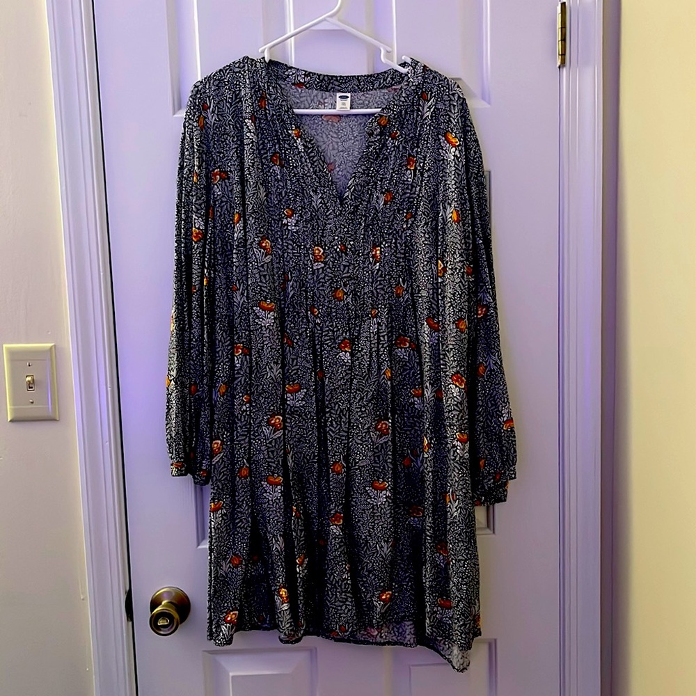 Black and which shirt with orange and red flowers